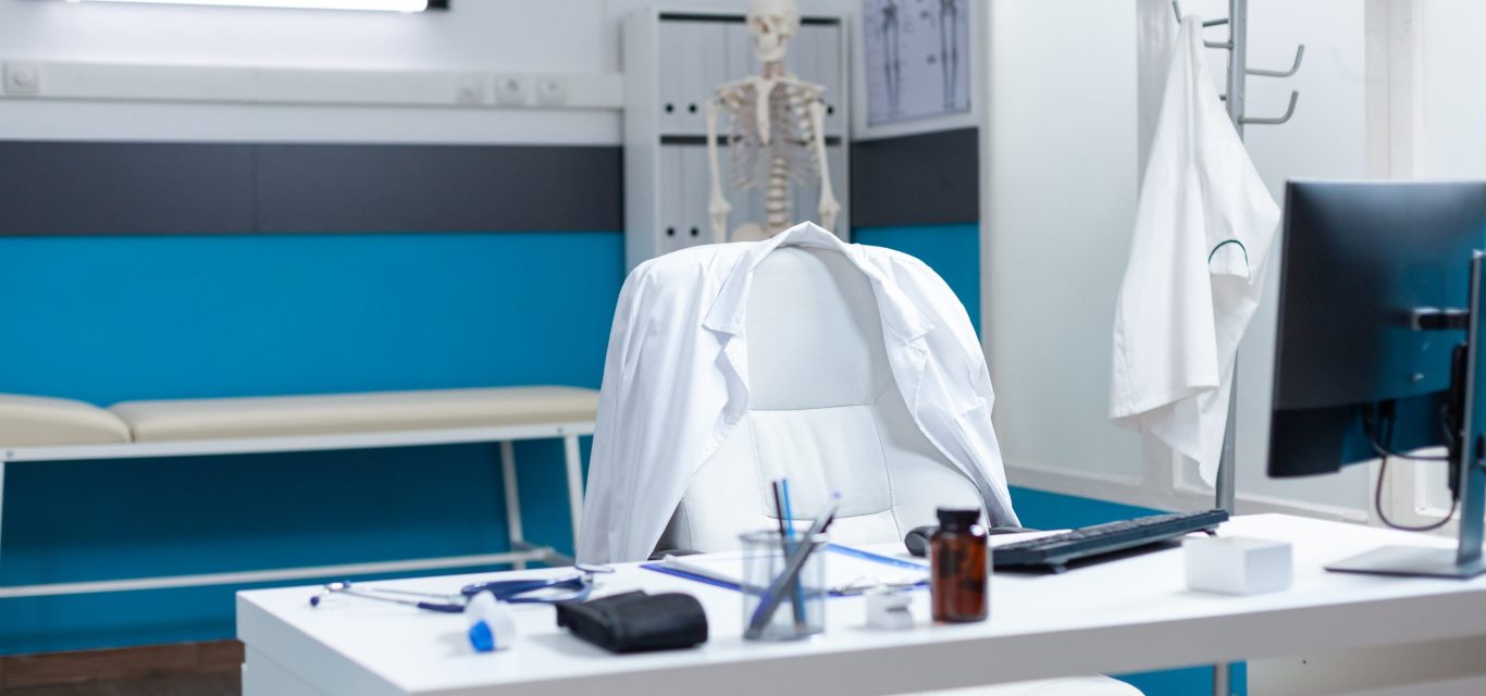 Empty modern medical office having disease documents on table equipped with contemporary furniture. Hospital workplace with nobody in it ready for sickness consultation. Medicine support